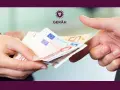 Manos intercambiando billetes de euro. Es obligatorio depositar la fianza en el IVIMA para formalizar el alquiler.