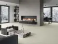 Elegante sala de estar con chimenea moderna y minimalista. La pared de la chimenea es ideal para decorar pared chimenea, con un diseño limpio y acogedor.