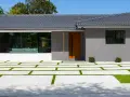 Casa moderna con entrada de madera y ventanal. El camino de acceso combina cemento y césped, ideal si me separo y quiero quedarme el piso.