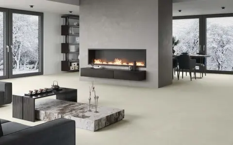 Elegante sala de estar con chimenea moderna y minimalista. La pared de la chimenea es ideal para decorar pared chimenea, con un diseño limpio y acogedor.