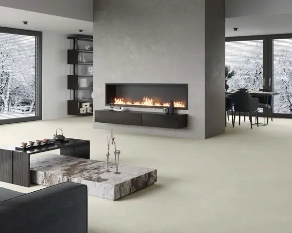Elegante sala de estar con chimenea moderna y minimalista. La pared de la chimenea es ideal para decorar pared chimenea, con un diseño limpio y acogedor.
