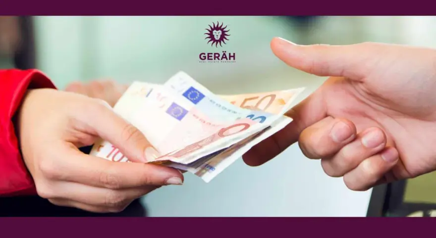 Manos intercambiando billetes de euro. Es obligatorio depositar la fianza en el IVIMA para formalizar el alquiler.