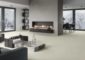 Elegante sala de estar con chimenea moderna y minimalista. La pared de la chimenea es ideal para decorar pared chimenea, con un diseño limpio y acogedor.