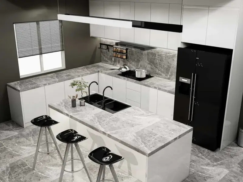 Moderna cocina blanca y gris claro con isla central, fregadero doble, taburetes negros y electrodomésticos de acero inoxidable.